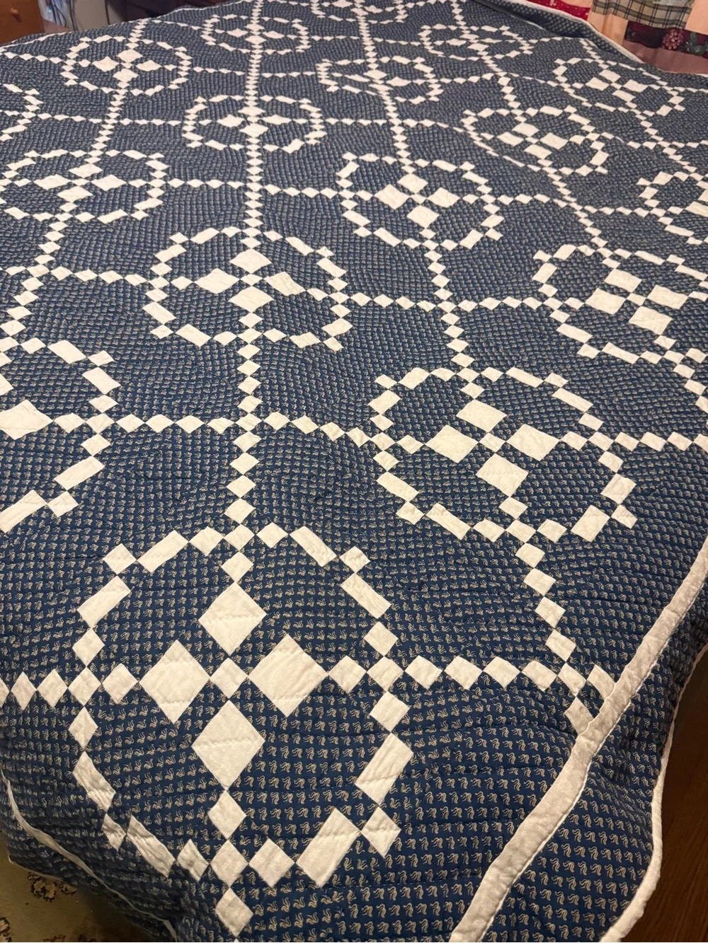 handmade patchwork quilt features the traditional Burgoyne Surrounded pattern